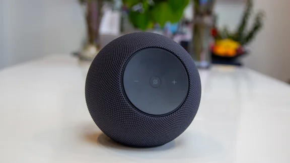 The Amazon Echo Studio 2025 pictured on a white table with plants in the background