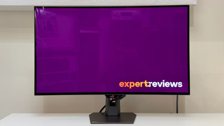 The Asus ROG Strix XG32UCW pictured from directly in front, on a white desktop