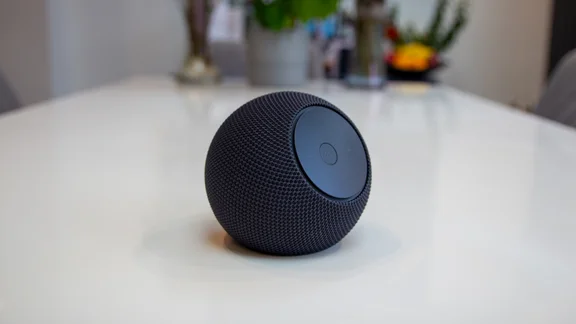 Amazon Echo Dot Max on a white table, photographed from the left