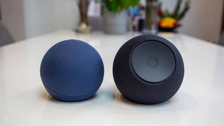 Amazon Echo Dot Max on a white table, photographed next to the 5th gen Echo Dot