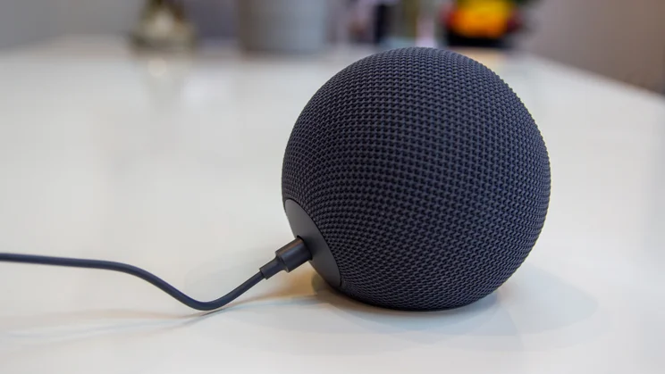 Amazon Echo Dot Max on a white table, photographed from the left side, connected to the mains