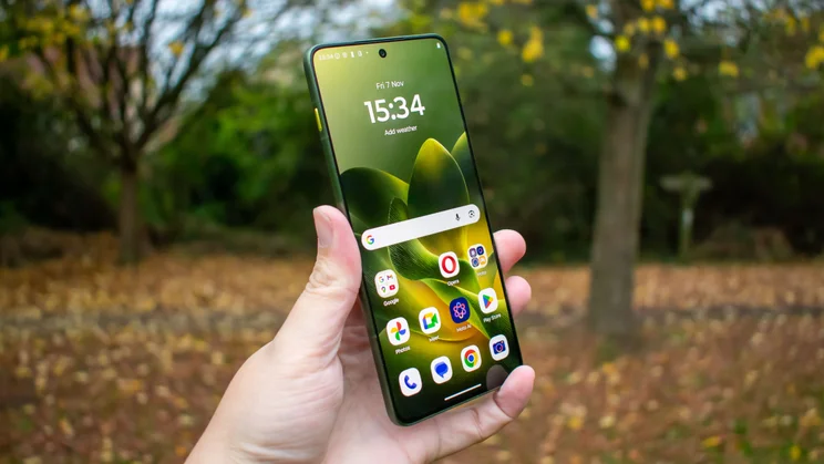 Motorola Edge 70 in hand, angled view