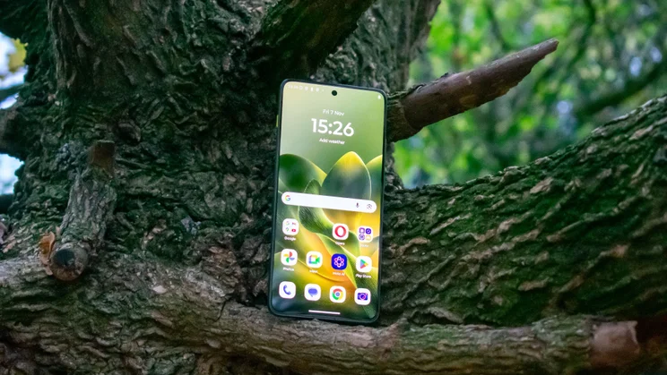 Motorola Edge 70 in a tree, display on