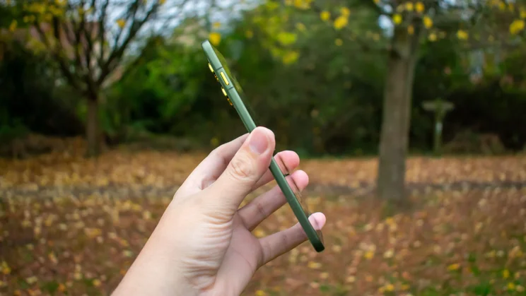 Motorola Edge 70 in hand, side view