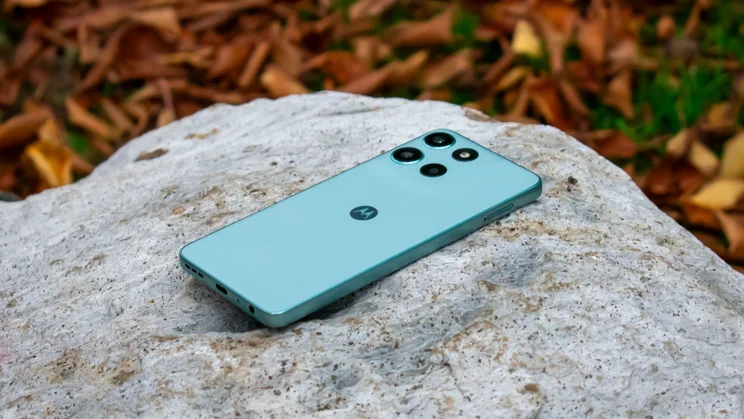Motorola Moto G56 face down on a rock