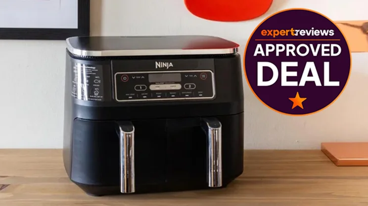 The Ninja Foodi Dual Zone air fryer on a kitchen worktop. A badge on the right hand side reads: Expert Reviews Approved Deal