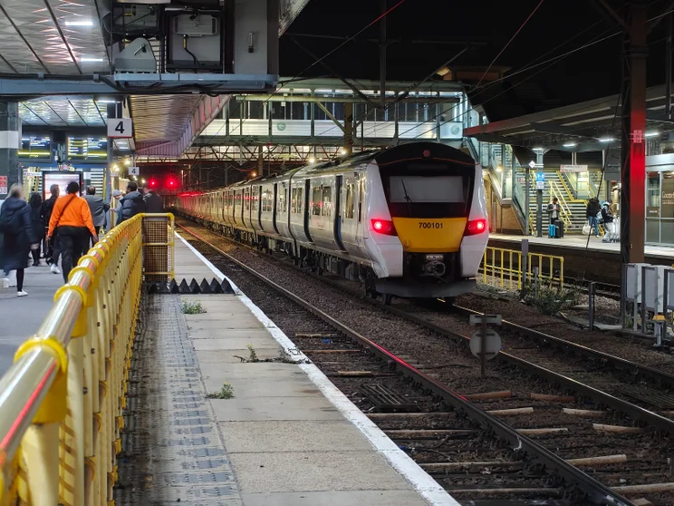 A train pulled into a station at night