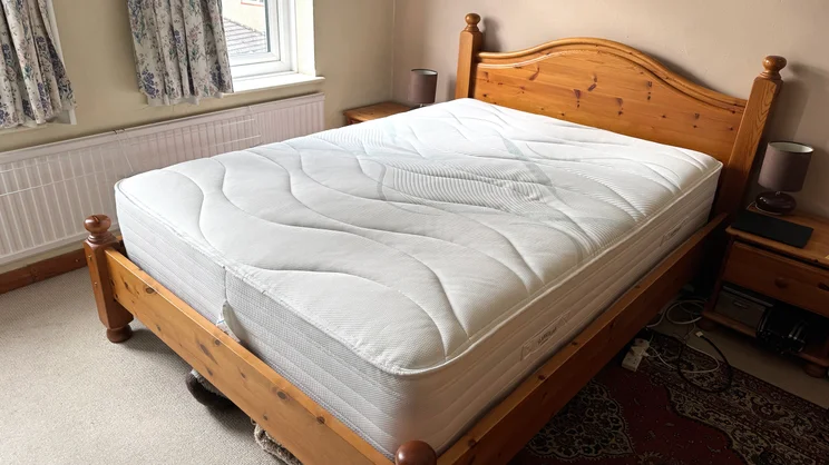 the Slumberland Air 6.0 Memory mattress on a wooden bed frame
