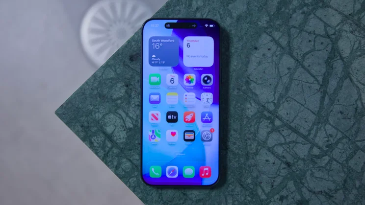 The Apple iPhone 17 Pro Max screen-up on a marbled table
