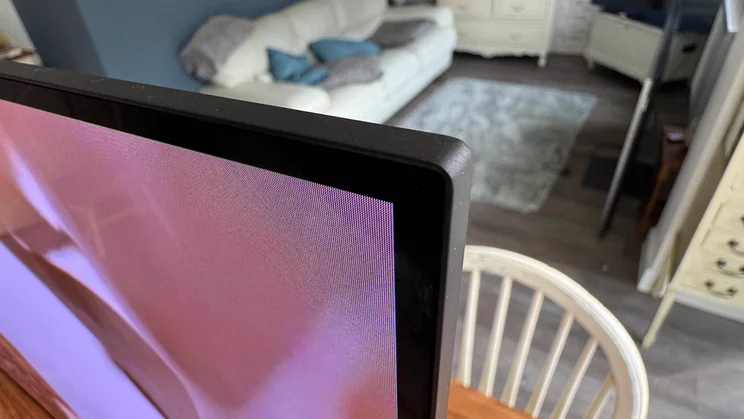 Close-up of the top-right corner of the Sony Bravia 8 II QD-OLED TV's panel