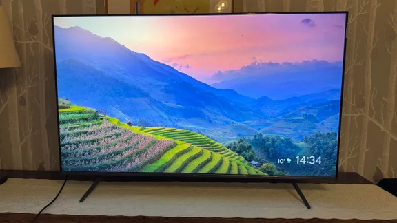 Front view of the TCL C6KS Mini LED TV displaying a colourful agricultural scene in Asia