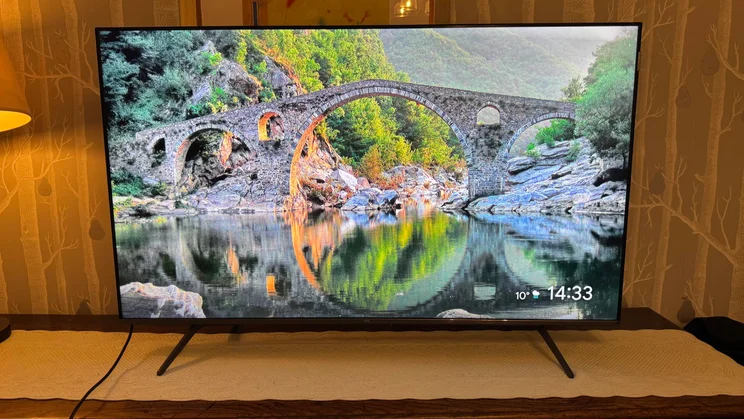 Front view of the TCL C6KS Mini LED TV displaying a picturesque river scene