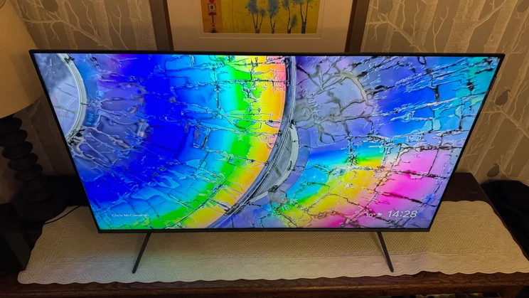 Top-down view of the TCL C6KS Mini LED TV displaying a technicolour pattern