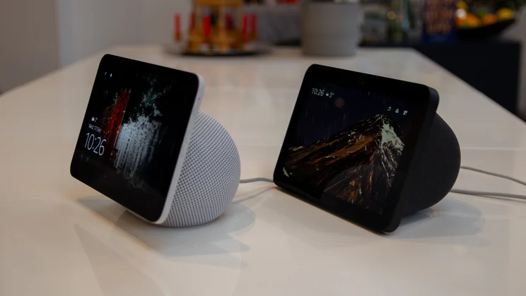 The Amazon Echo Show 8 (4th gen, 2025) pictured from the front right on a white table next to the 3rd gen Echo Show 8