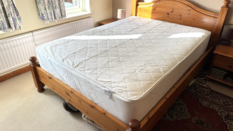 The Dusk Luxury Quilted Mattress Protector on a mattress