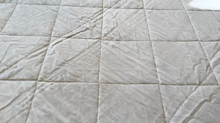 A closeup of the surface of the Dusk Luxury Quilted Mattress Protector