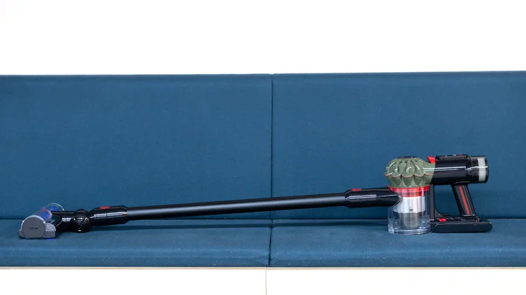 The Dyson V8 Cyclone on a blue office bench