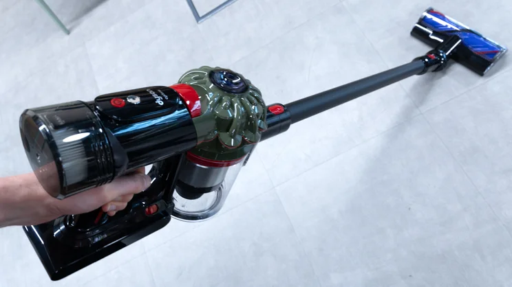 The Dyson V8 Cyclone vacuum in a hand
