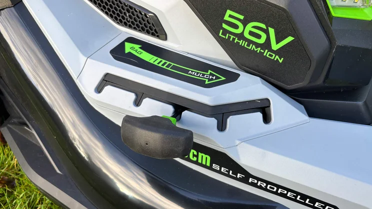 A closeup of the LM2236E-SP lawn mower's collection bag/mulch adjustment lever