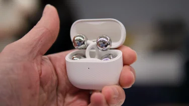 Huawei FreeClip 2 being held in hand