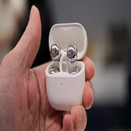 Huawei FreeClip 2 being held in hand