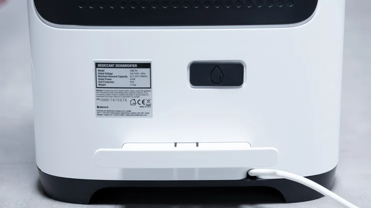 The rear base of the Meaco DD8L Pro dehumidifier, showing the cable tidy and continuous drainage output