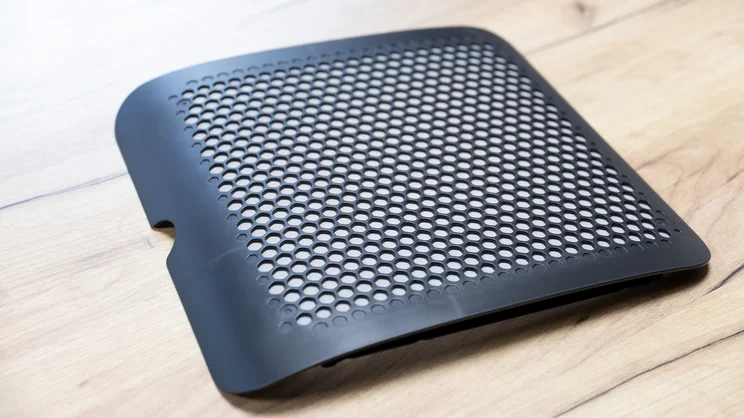 The Meaco DD8L Pro dehumidifier's filter cover, removed on a table top