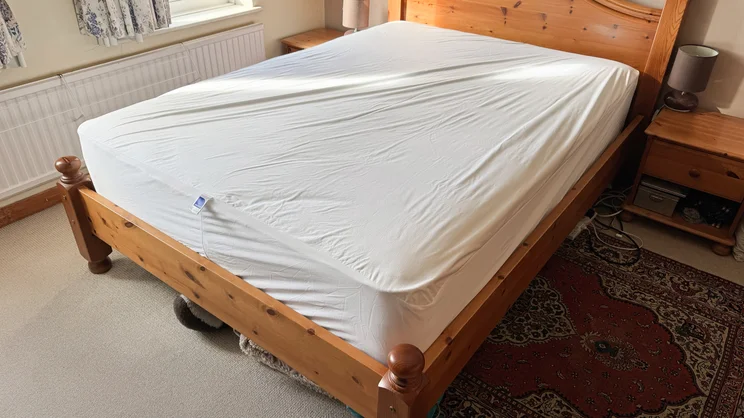 The Nectar mattress protector on a mattress
