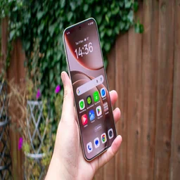 Oppo Find X9 Pro in hand, angled view