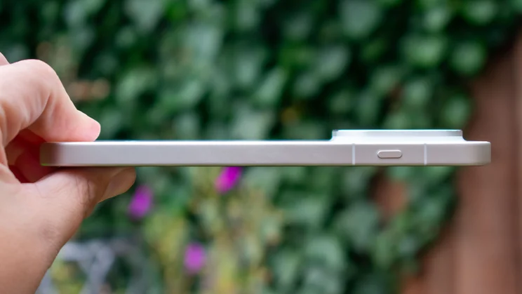 Oppo Find X9 Pro in hand, side view