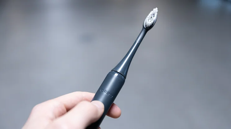 The Ordo Sonic Edge toothbrush in a hand