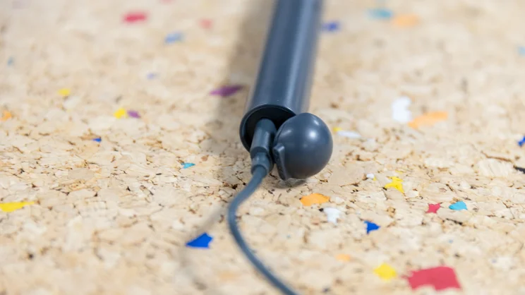 A closeup of the base of the Ordo Sonic Edge toothbrush, with cable plugged into charging port