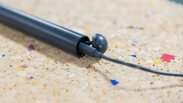 A closeup of the base of the Ordo Sonic Edge toothbrush, with cable plugged into charging port