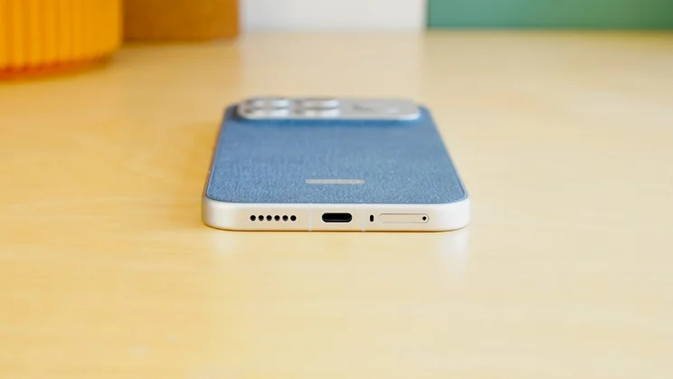 Poco F8 Ultra on a table, showing the bottom edge and charging port