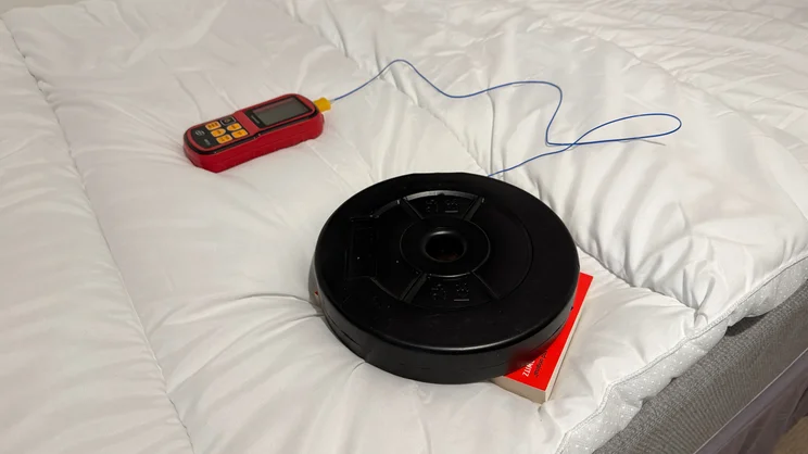 Testing the heat retention of the Slumberdown Sleep Soundly Climate Control mattress topper, using a thermocouple, book and 2.5kg weight disc