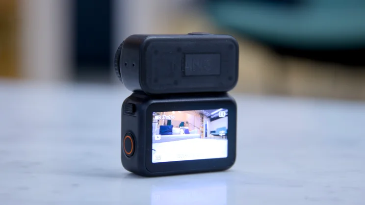 The DJI OSMO Nano action camera pictured from the rear attached to its Vision Dock remote screen