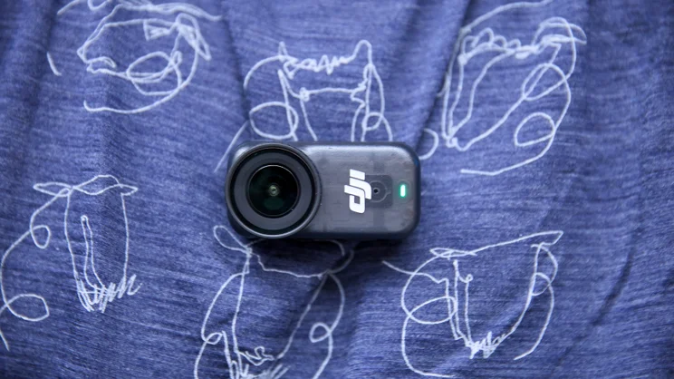 The DJI OSMO Nano attached to a blue T-shirt