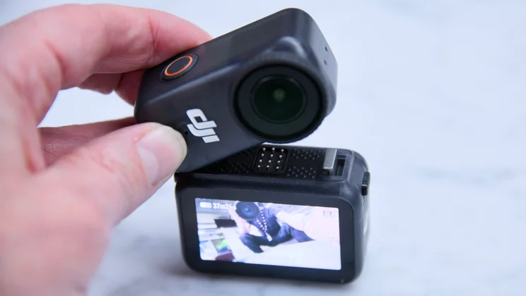 The DJI OSMO Nano camera being attached to its Vision Dock
