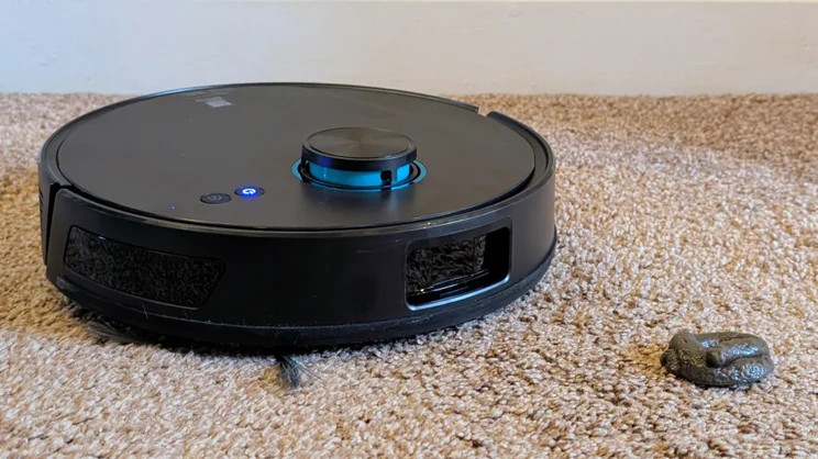 The Ultenic T20 Pro shown next to a fake cat poo