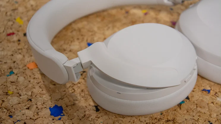 The hanger connecting the right earcup to the headband of the Philips H8000E over-ear headphones