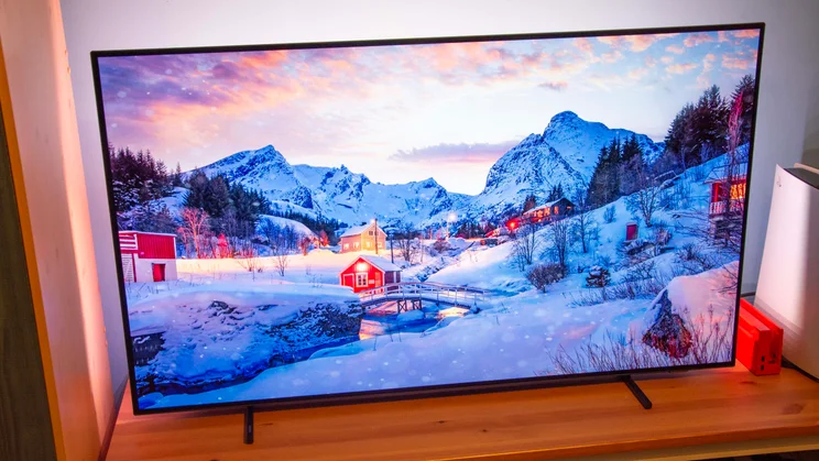 Front view of the Philips OLED760 TV displaying a snowy winter wonderland