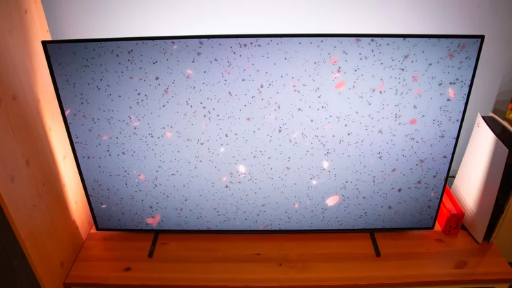 Top-down view of the Philips OLED760 TV displaying a grey background and confetti