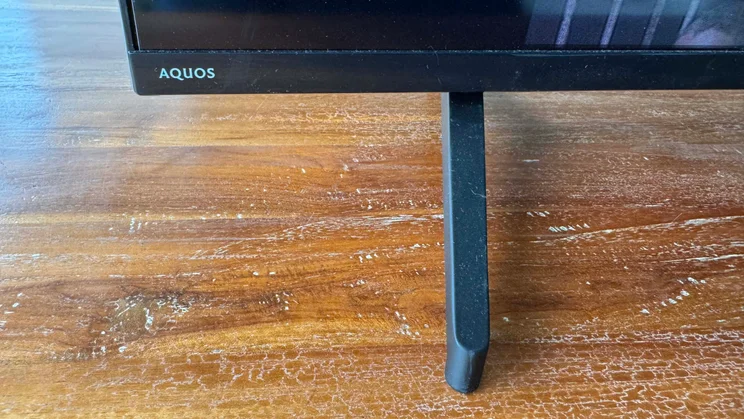 Close-up front view of the left foot of the Sharp GK4245K TV