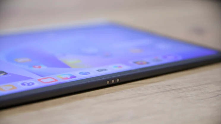 A close up view of the Huawei MatePad 11.5 S (2026)'s bottom edge, on a wood table