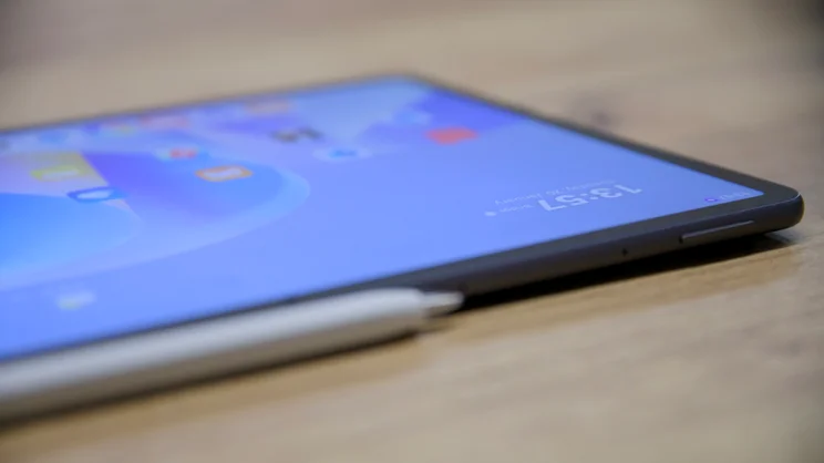 A close up view of the Huawei MatePad 11.5 S (2026)'s volume rocker button, on a wood table