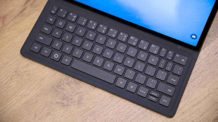 A top down view of the Huawei MatePad 11.5 S (2026)'s keyboard case, on a wood table