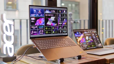 The Acer Swift 16 AI (2026) on a laptop stand with an Acer logo to the left