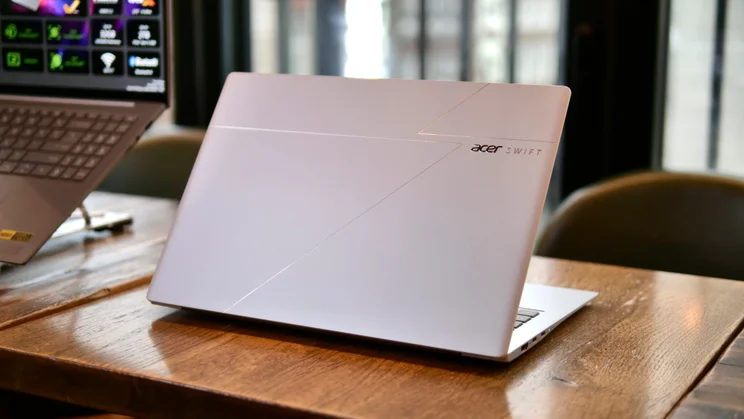 Acer Swift Edge 14 AI (2026) pictured from the rear on a wood table