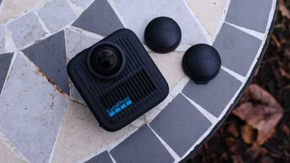 GoPro Max 2 on a garden table with lens caps next to it