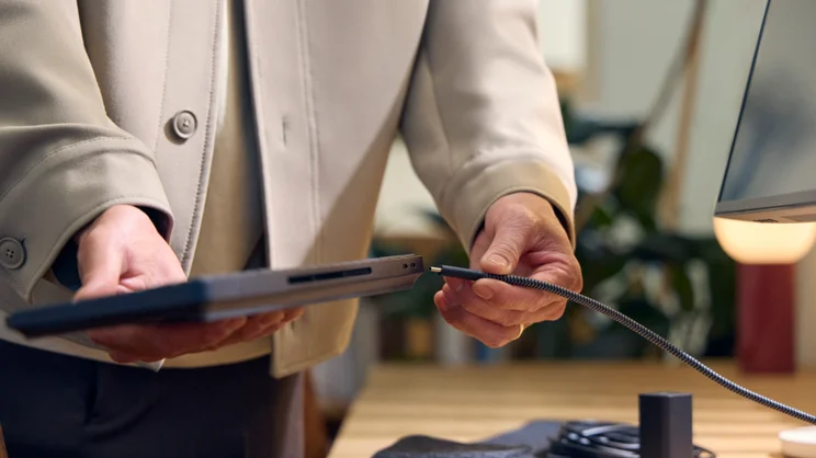 The HP EliteBoard G1a, pictured from the rear, being connected to a monitor via USB-C